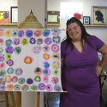 Nicole stands by her cloth art.  Her piece was shown in an art show of her peers at Metzenbaum Opportunity Center.